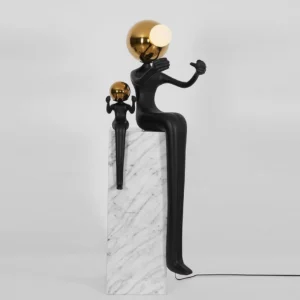 Aura modern floor lamp left side view showing parent-child sculpture design with power cord on white background