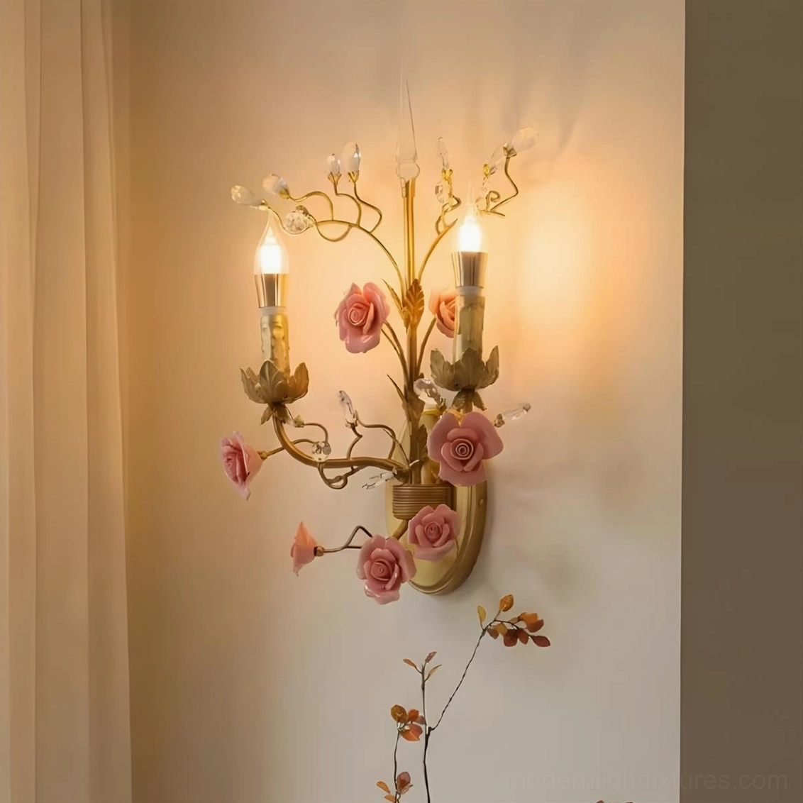 Aureflora floral branch wall sconce close-up mounted on accent wall, pastoral romantic gold branches with pink roses