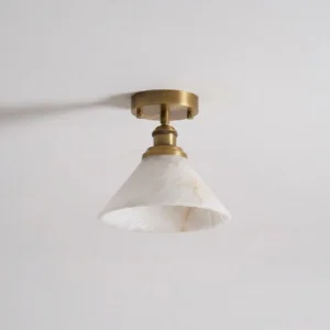 Aurelia semi-flush mount alabaster ceiling fixture side angle view, showcasing brass hardware and natural stone veining texture