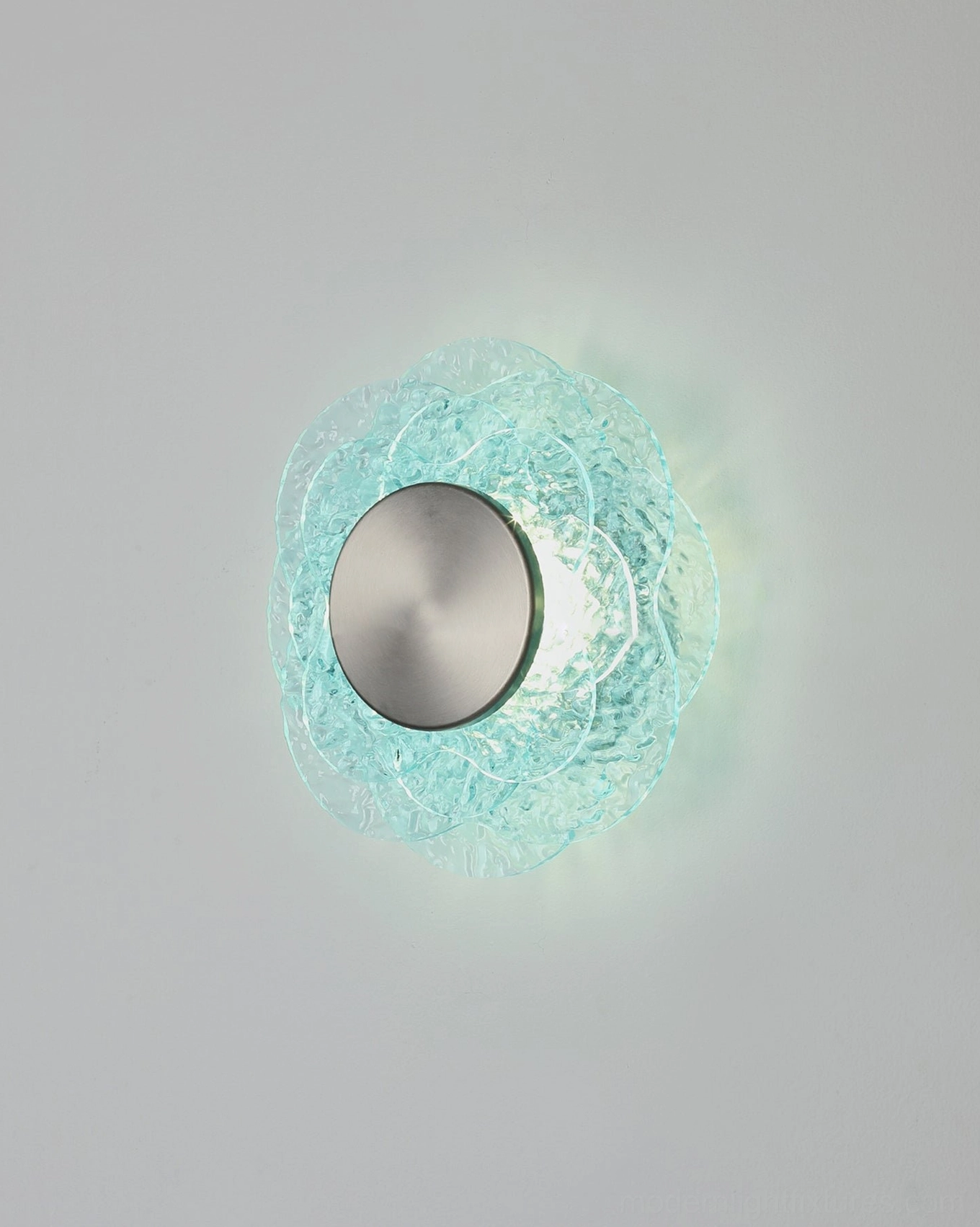 Aurelia floral glass wall sconce close-up with brushed silver metal base and cyan textured shade