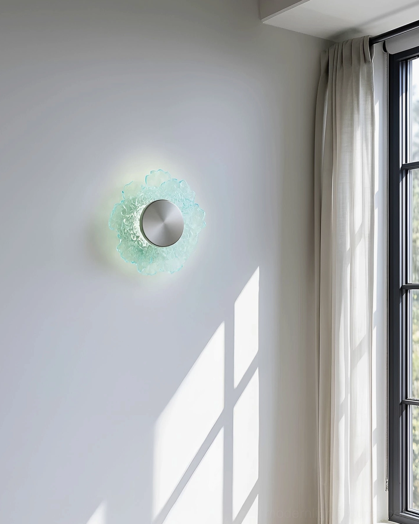 Aurelia LED wall sconce mounted beside residential window with decorative shadow casting effect