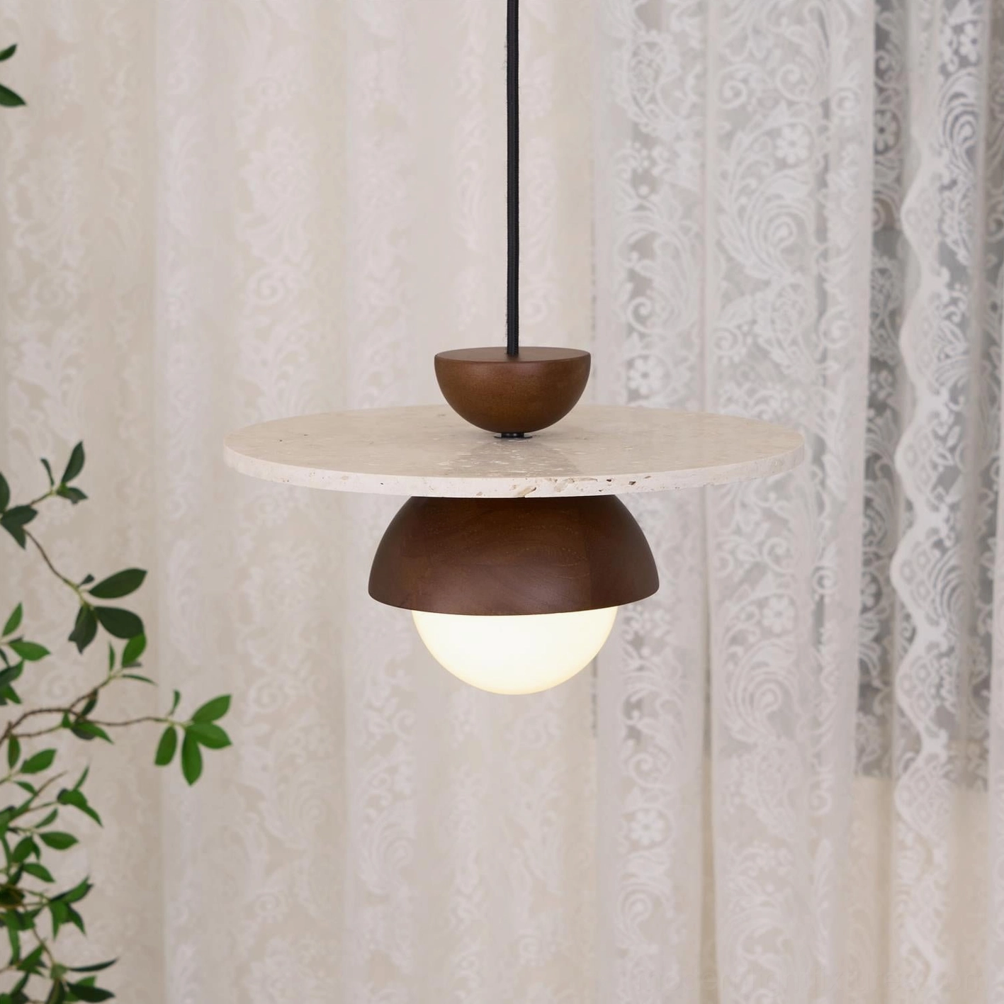 Contemporary travertine and glass pendant light showing authentic natural stone characteristics