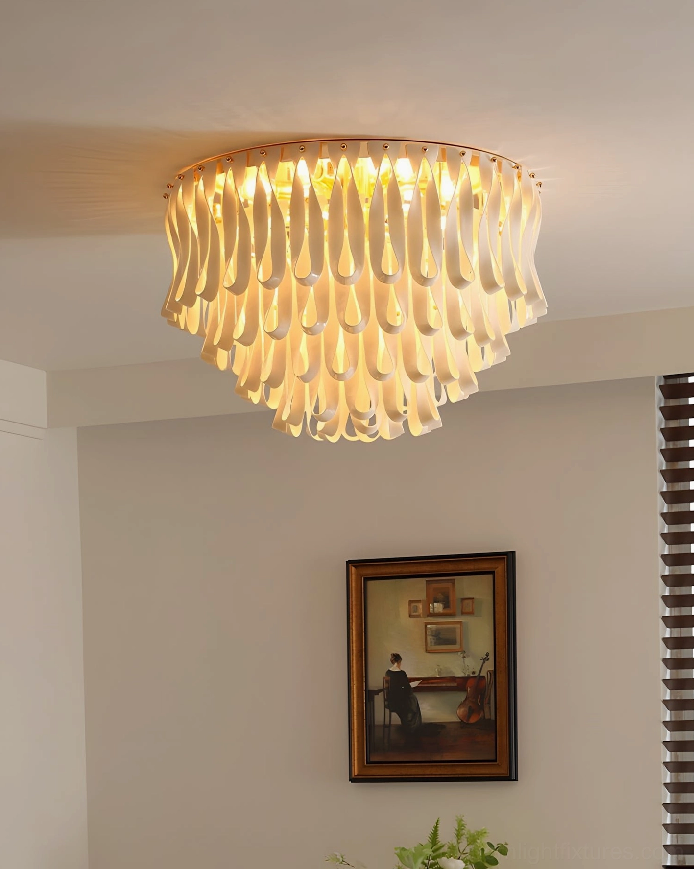 Tiered ceramic flush mount fixture in contemporary residential space with framed wall art and window blinds