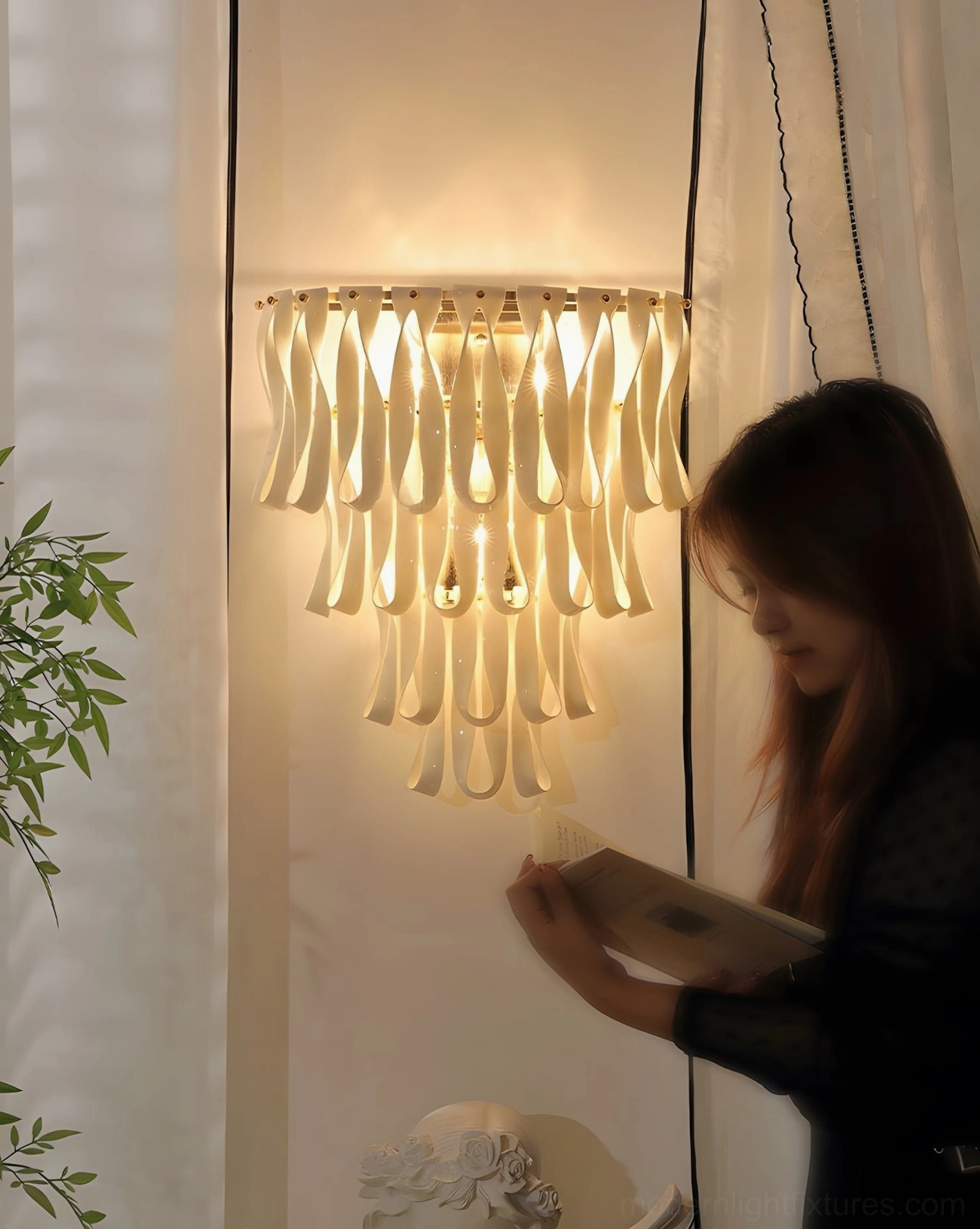 Warm glowing ribbon wall sconce in reading nook with sheer curtains providing ambient illumination for seated reader