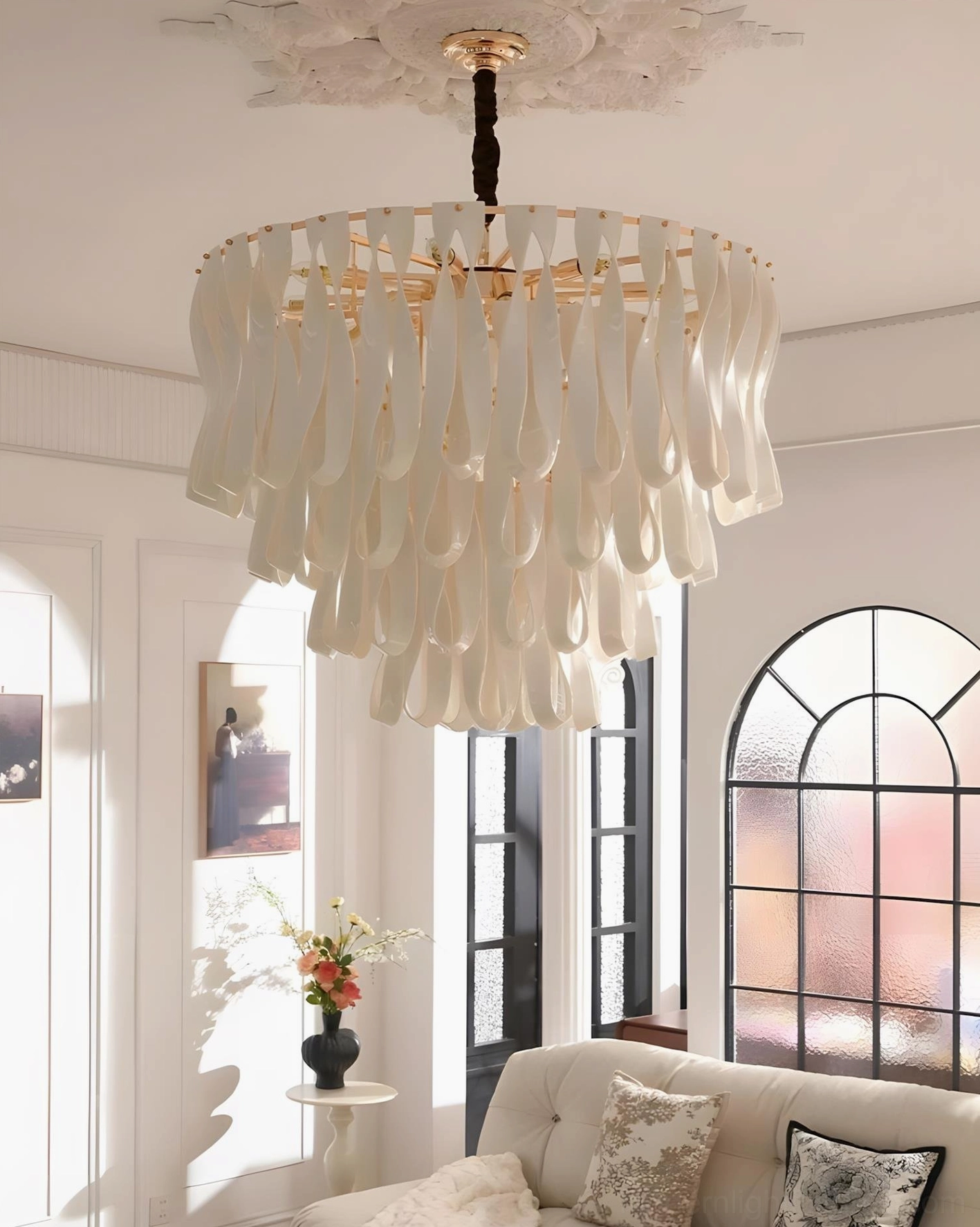Avelisse round tiered pendant chandelier in cozy sitting room with arched windows and neutral home decor