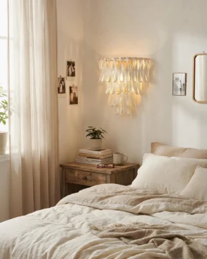 Avelisse wall sconce installed above bedroom nightstand creating warm ambient light for bedside reading in master bedroom