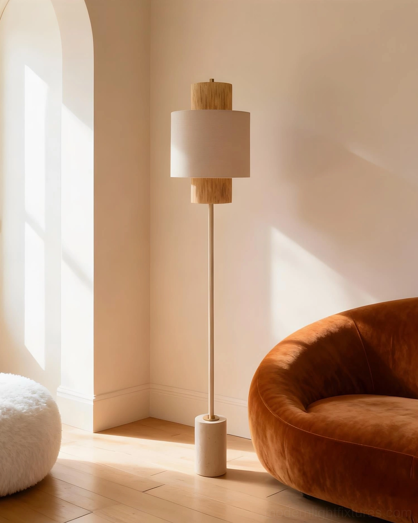 Avenor floor lamp in minimalist interior corner with burnt orange velvet sofa and light wood flooring