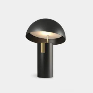 Avo modern mushroom LED table lamp with matte black finish and brass accent, front low angle view in studio lighting