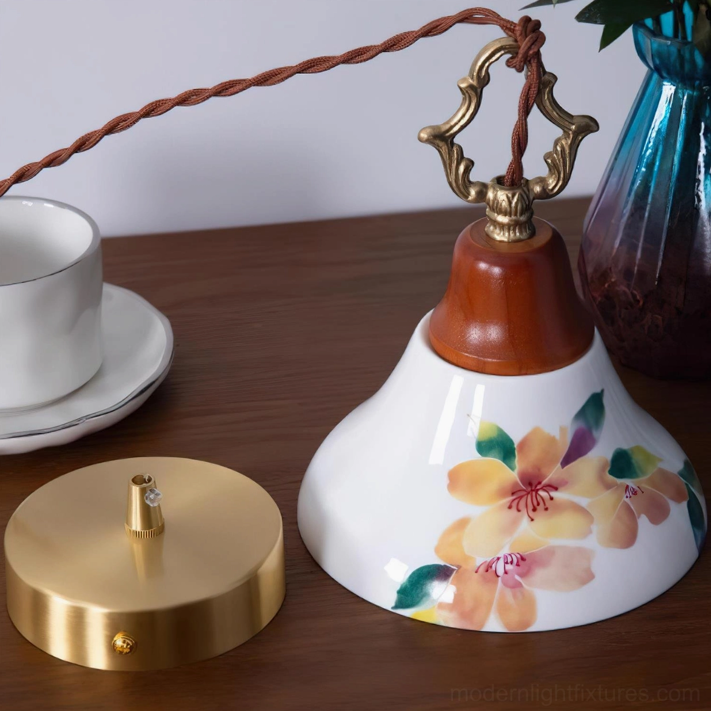 Hand-painted azalea ceramic pendant light collection showing pink, blue and yellow floral color options with brass and wood hardware
