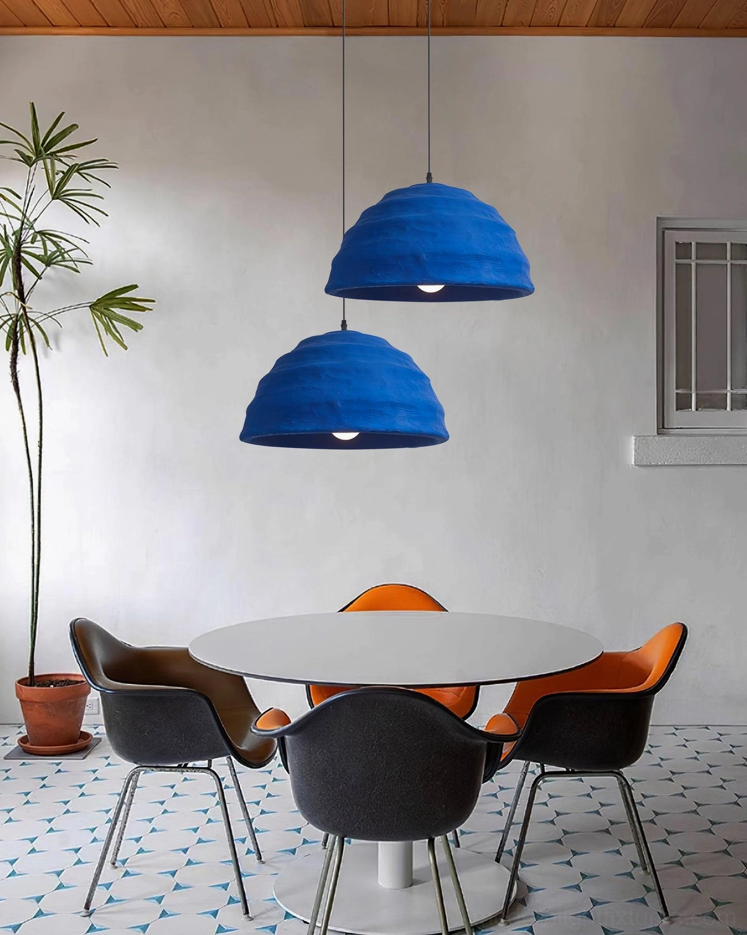 Azure dome pendant light installation showing scale relative to furniture and room proportions