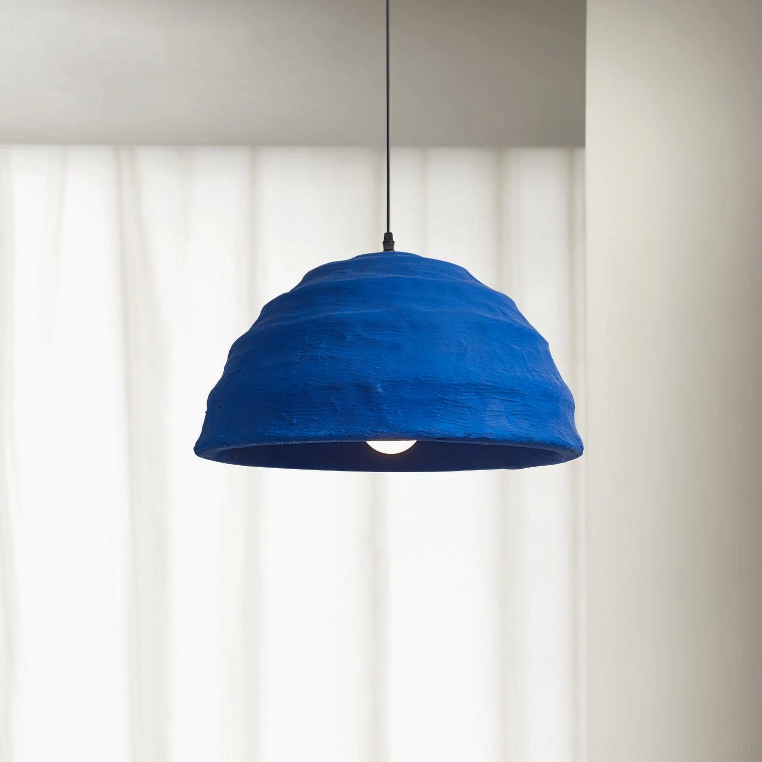 Side view of azure dome pendant light showing wavy ribbed texture and matte royal blue surface finish