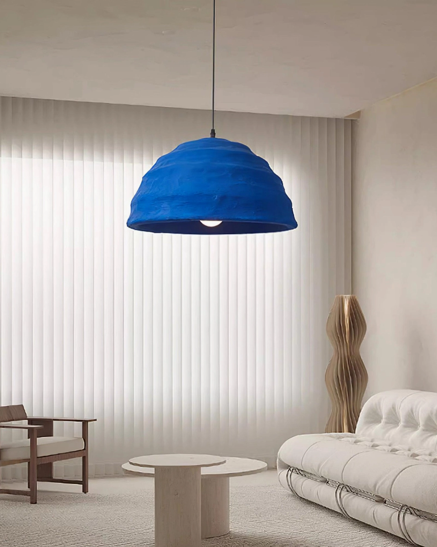 Azure dome pendant light with warm bottom studio lighting emphasizing crafted texture and blue color