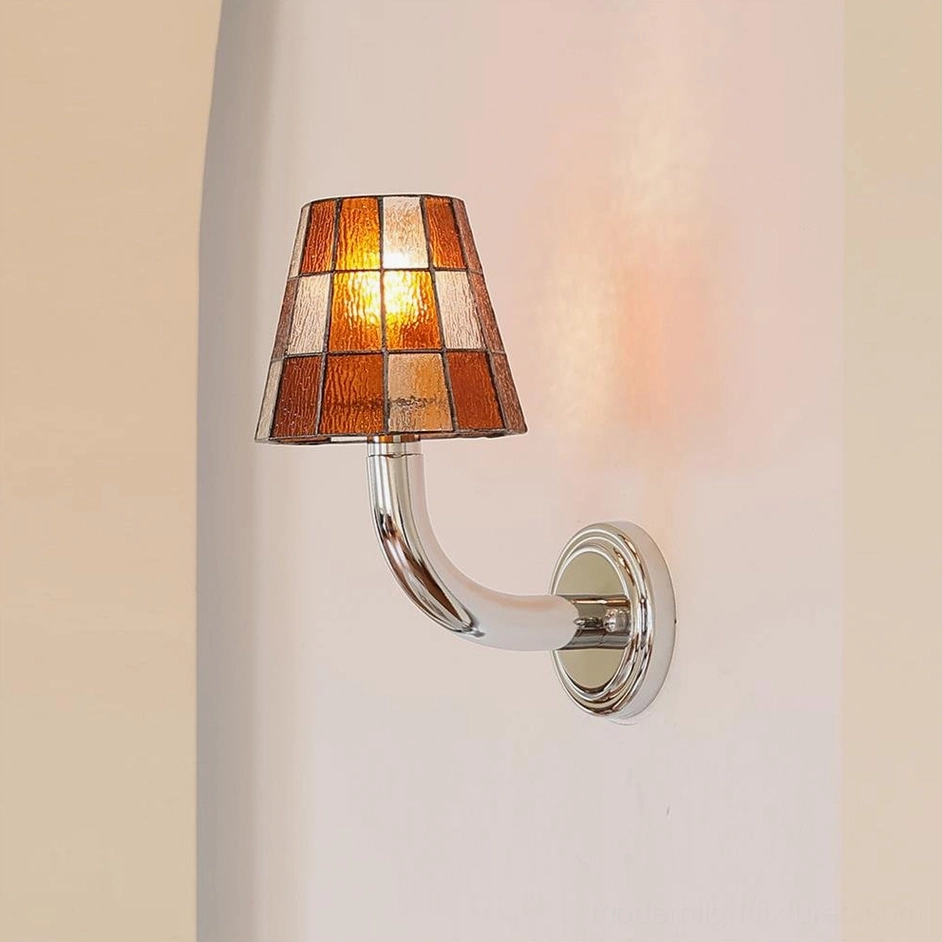 Azurielle amber stained glass wall sconce side perspective mounted on indoor corridor wall with warm illumination