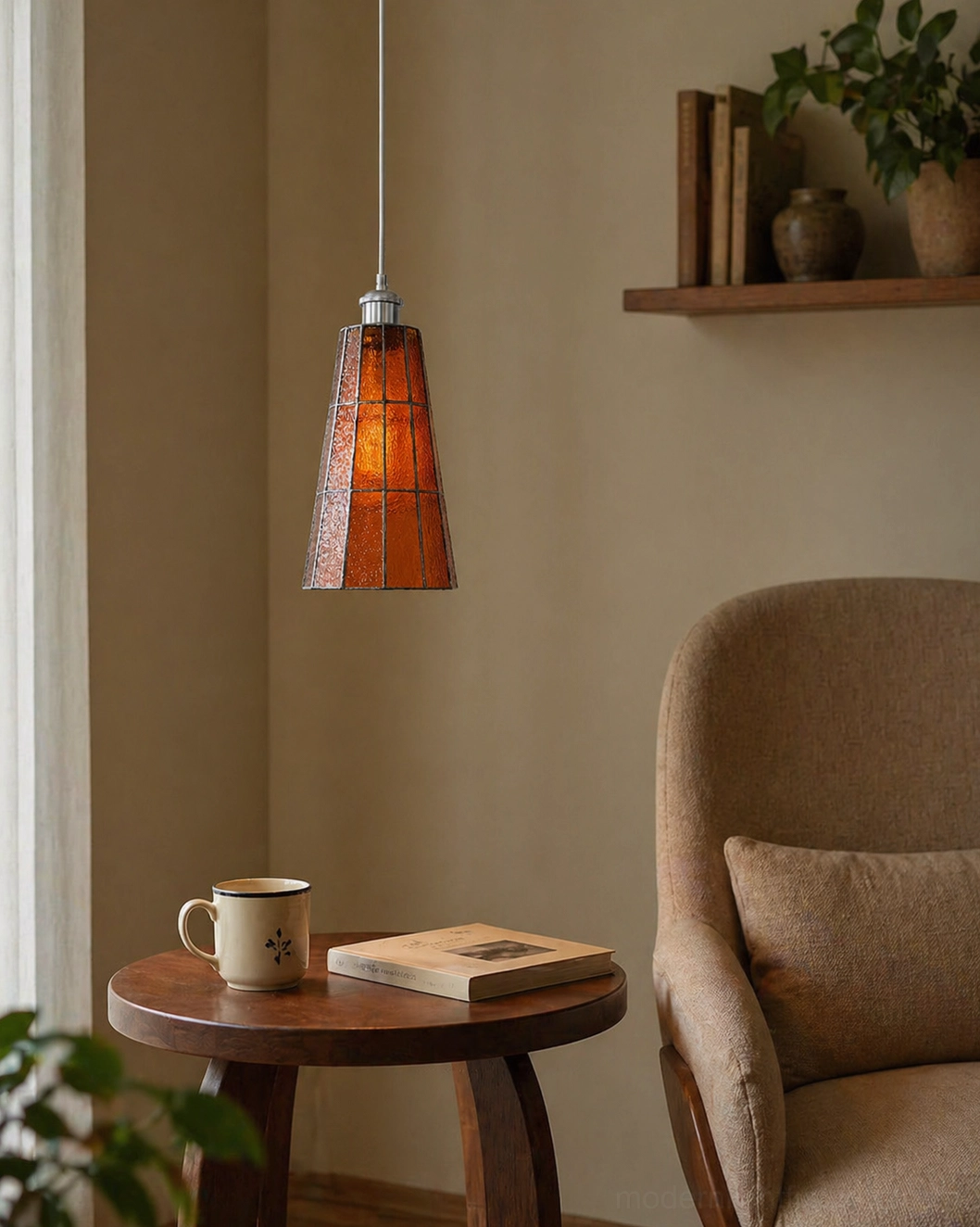 Azurielle amber handcrafted glass pendant creating warm glow in cozy reading lounge