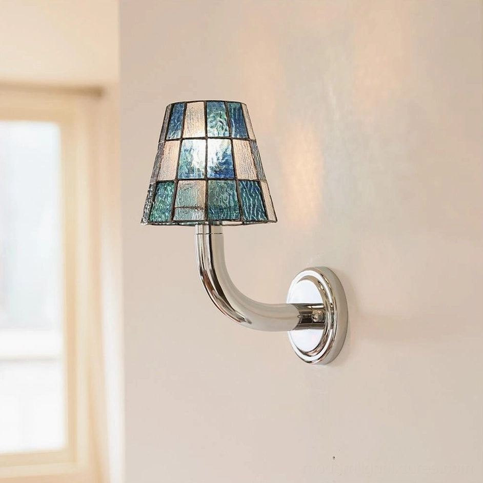 Close-up frontal view of Azurielle stained glass wall sconce with blue-white checkered pattern and curved chrome arm