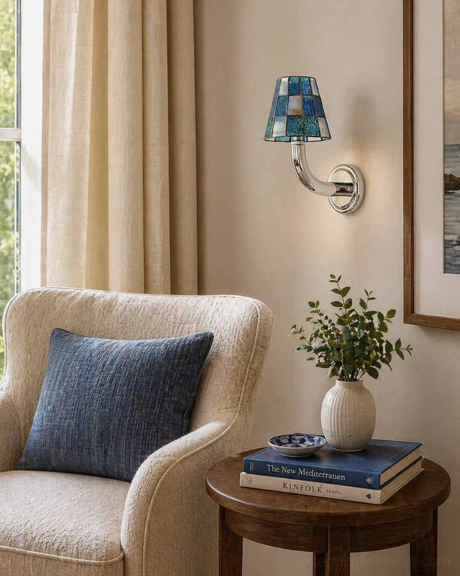 Azurielle blue checkered stained glass wall sconce installed in cozy living room beside armchair