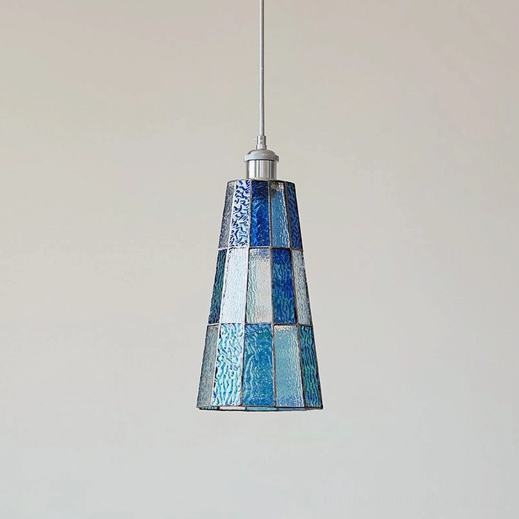 Azurielle blue patchwork stained glass pendant light illuminated overhead view