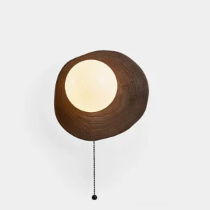 Bacia wood wall sconce front view studio display with dark walnut wood ring and frosted glass sphere