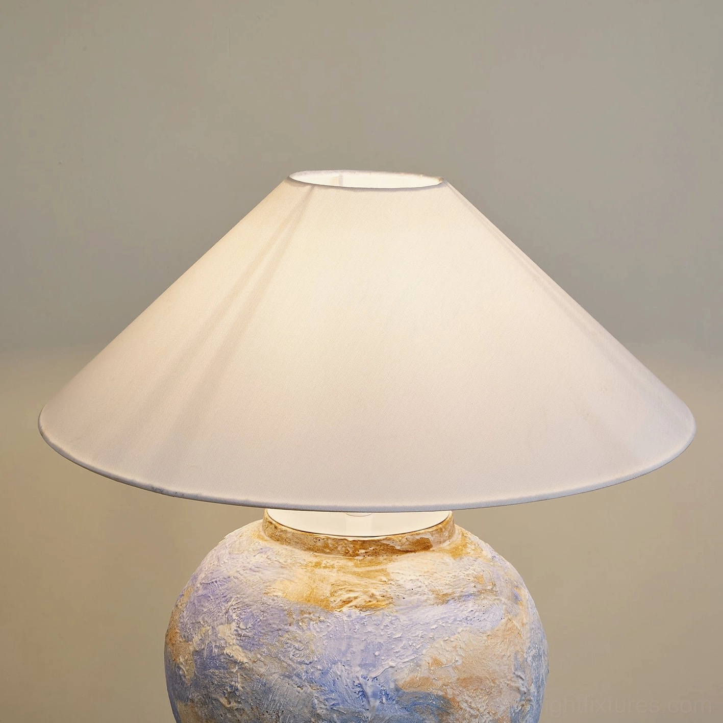Bailey table lamp in contemporary interior design with blue ceramic base and fabric shade