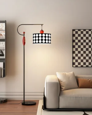 Modern arc floor lamp with drum shade in contemporary light gray sofa living room setting