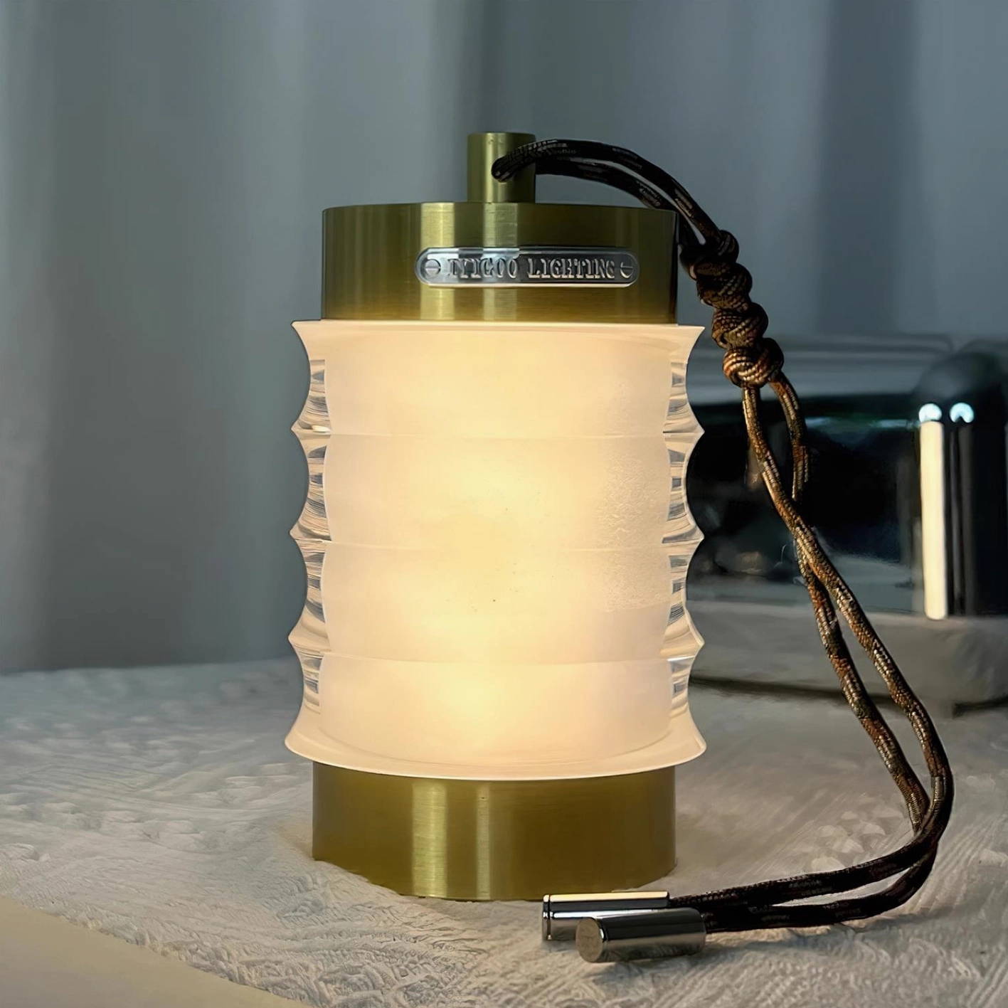 Gold finish Balia portable rechargeable table lamp, premium aluminum construction with rippled acrylic diffuser design