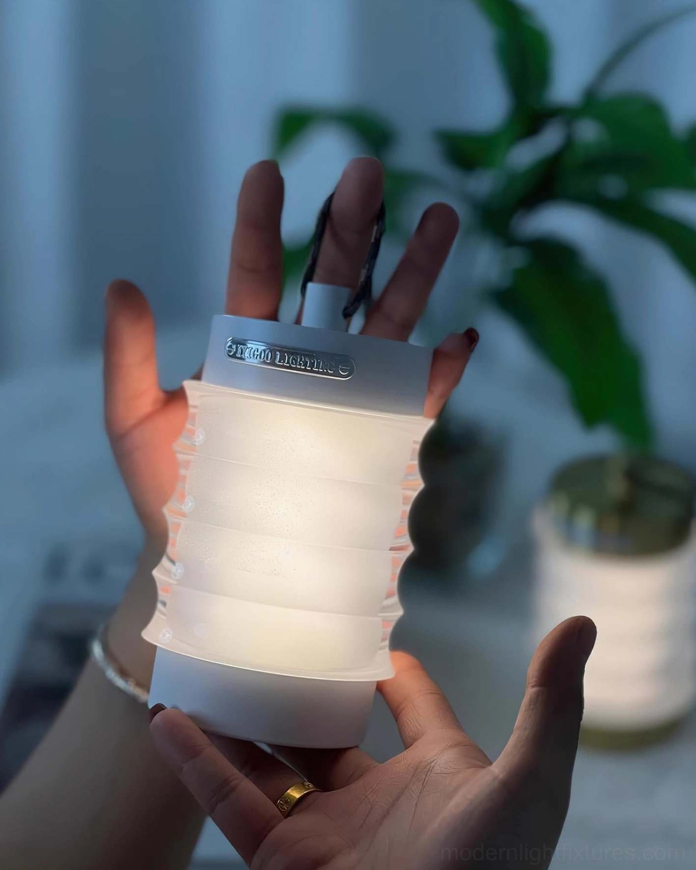 Balia portable table lamp demonstrating lightweight design with integrated carrying handle for mobility and relocation
