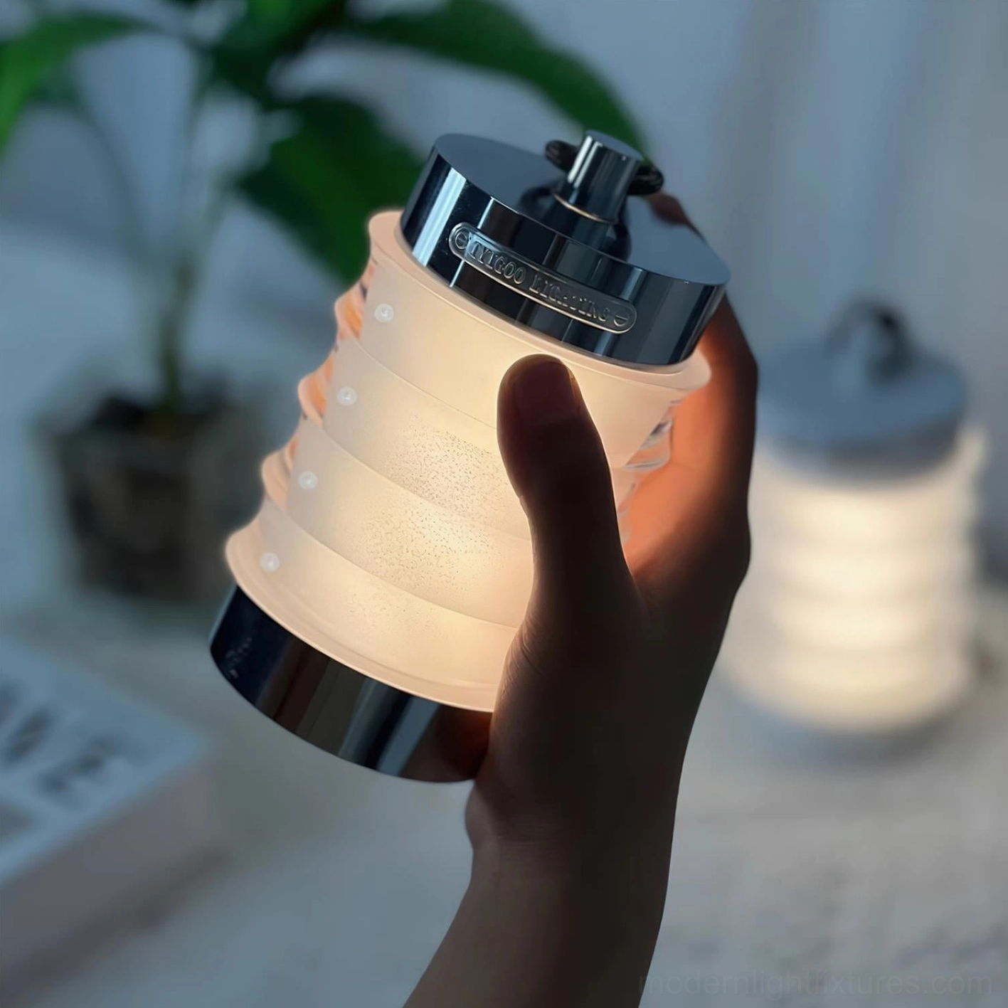 White Balia portable rechargeable table lamp with Scandinavian-inspired minimalist aesthetic and aluminum metallic accents