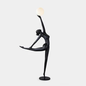 Ballerina arabesque floor lamp with matte black resin body and white spherical glass shade, left profile view
