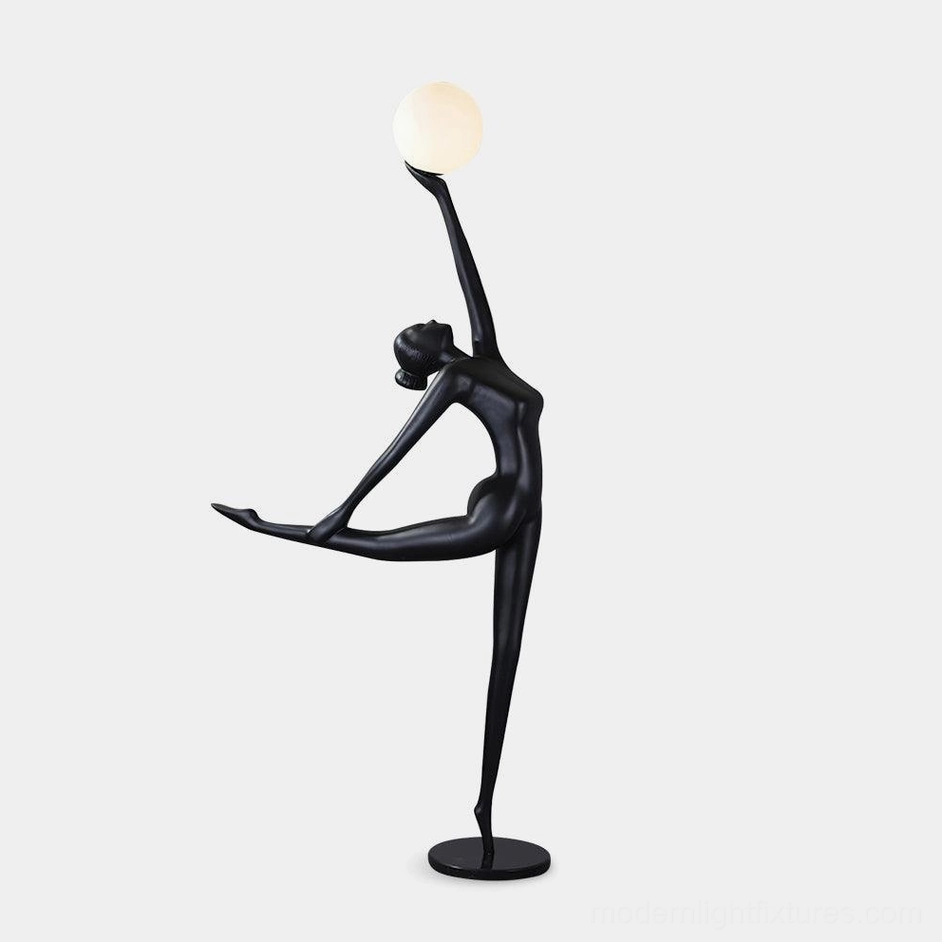 Ballerina arabesque floor lamp with matte black resin body and white spherical glass shade, left profile view