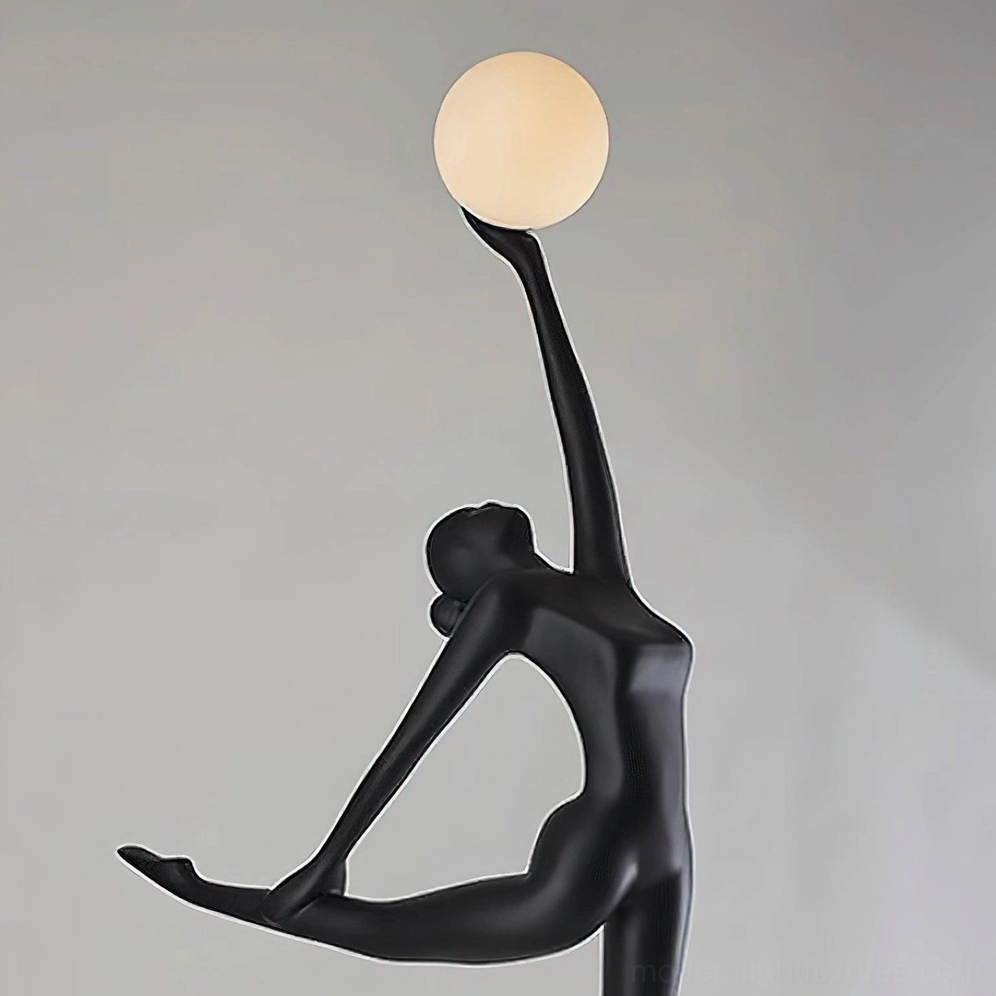 Contemporary ballerina floor lamp with artistic human form sculpture and white glass orb illumination