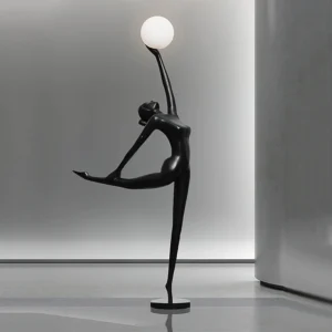 Modern sculptural ballerina dancer floor lamp on concrete showroom floor, minimalist concrete setting