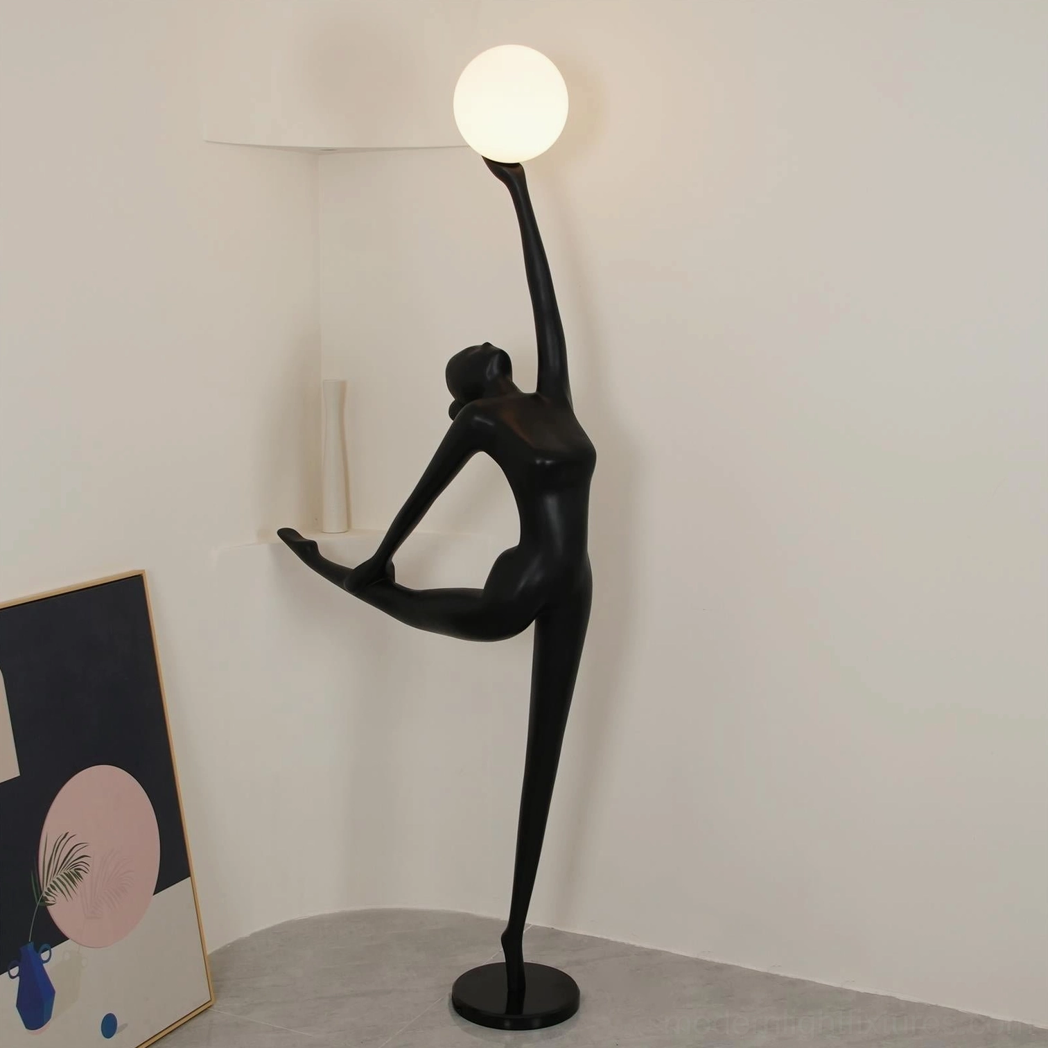 Modern ballerina arabesque floor lamp left profile with white spherical light source and black resin form