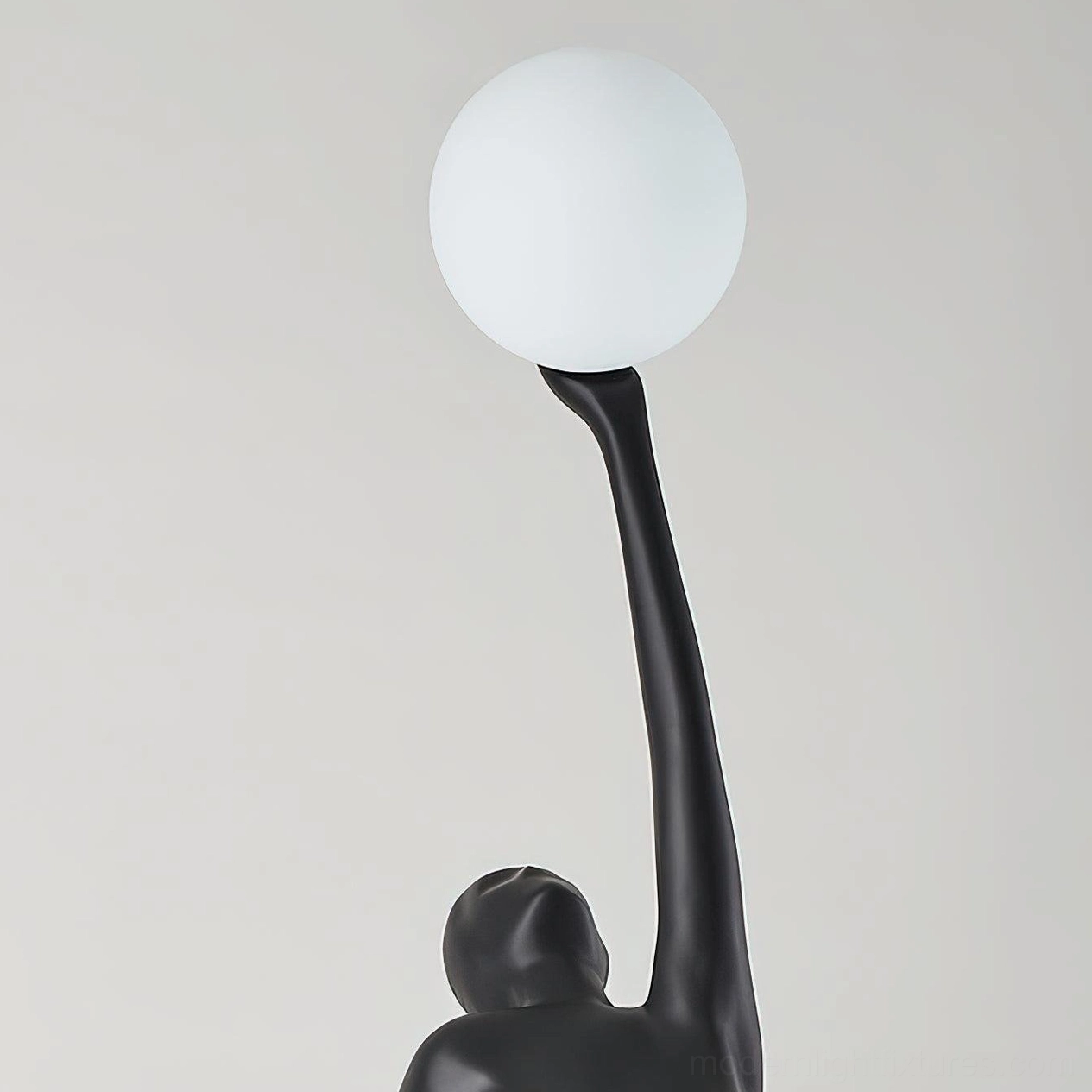 Artistic ballerina statue floor lamp with matte black finish and contemporary glass shade design