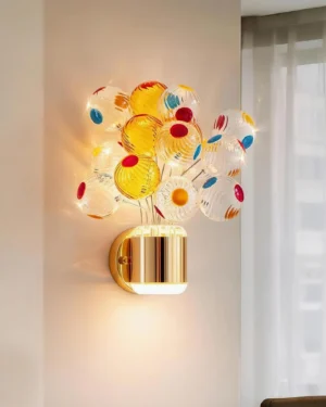 Gold and Multicolor Balloon Bouquet Wall Sconce mounted on living room wall with sheer curtains, warm LED light glowing through dotted glass orbs