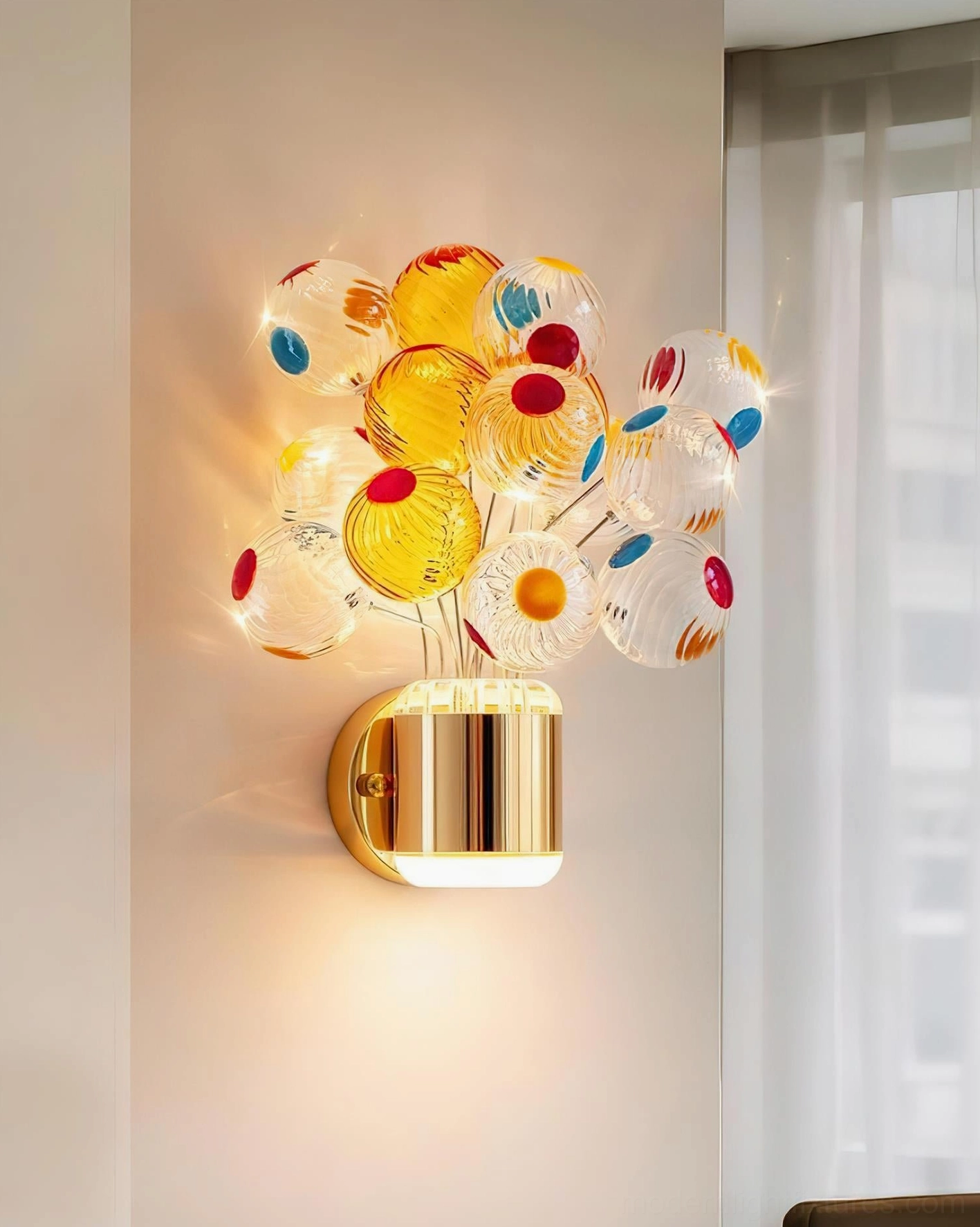 Gold and Multicolor Balloon Bouquet Wall Sconce mounted on living room wall with sheer curtains, warm LED light glowing through dotted glass orbs