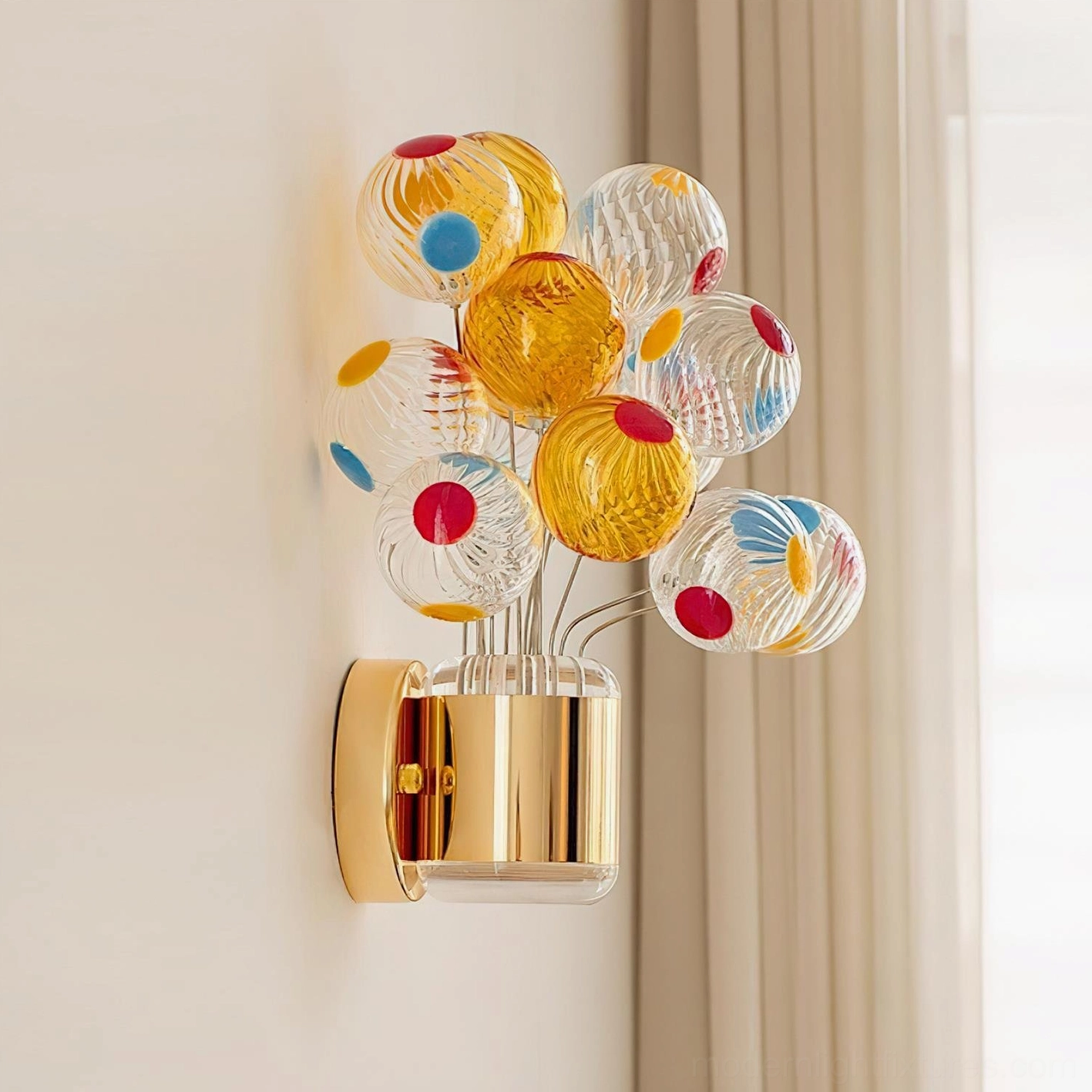 Gold and Multicolor Balloon Bouquet Wall Sconce installed as side wall view with warm glowing illumination and sheer window backdrop