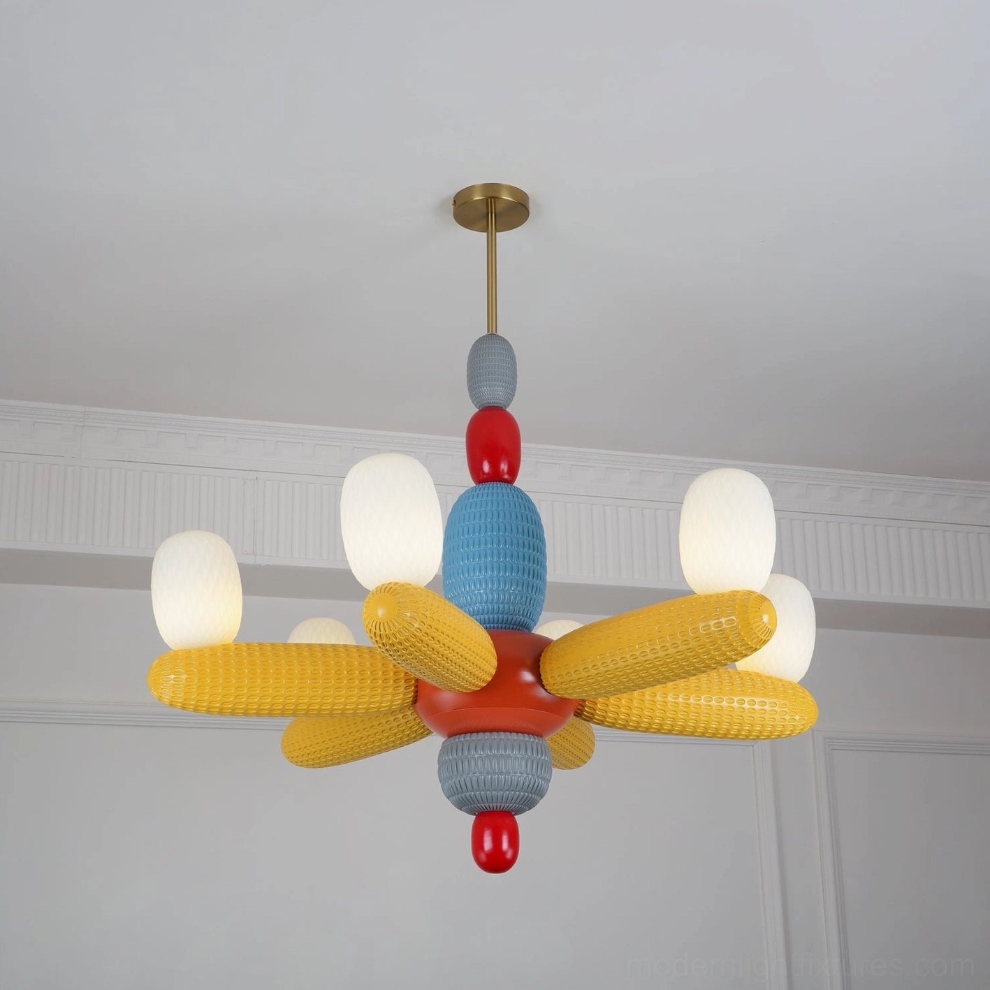 Balloon chandelier with six yellow fabric arms and frosted glass bulb shades in minimalist setting