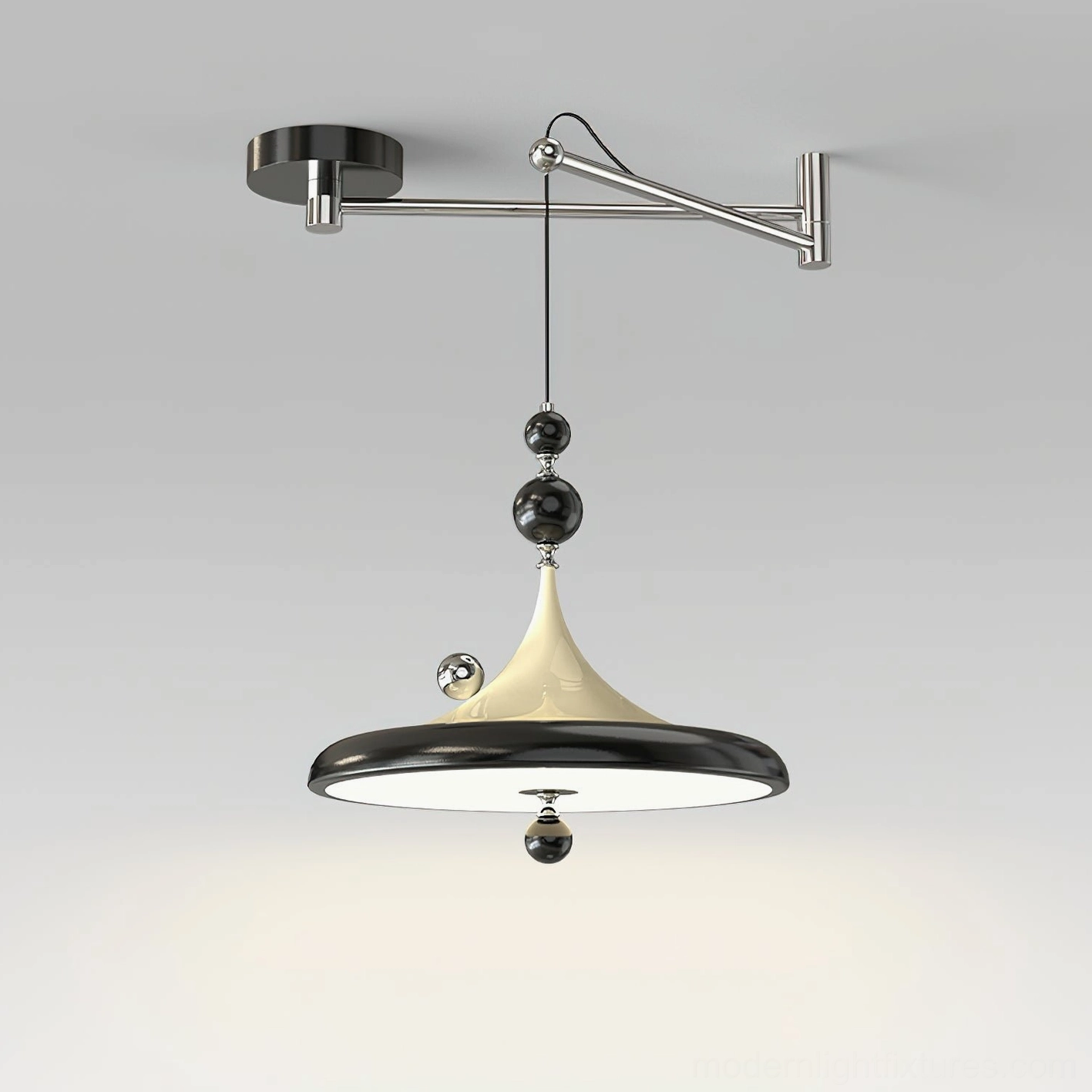 Black and beige adjustable swing arm pendant lamp with polished metal details, front angle showing decorative bead accents and tapered neck