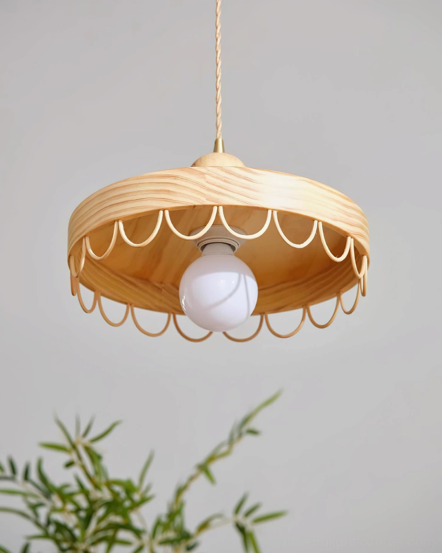 Bottom view of Balton wooden pendant lamp showing scalloped metal guard and exposed globe bulb in living room setting