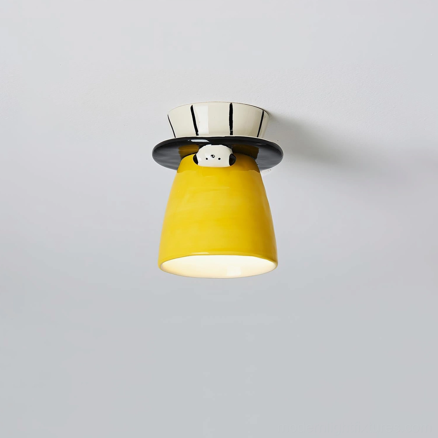 Bambino yellow ceramic ceiling light fixture - contemporary playful design with black collar and puppy sculpture