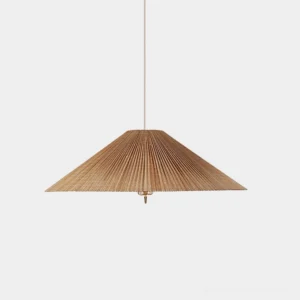 Handwoven bamboo conical pendant light with brass stem, mid-century modern design, front studio view