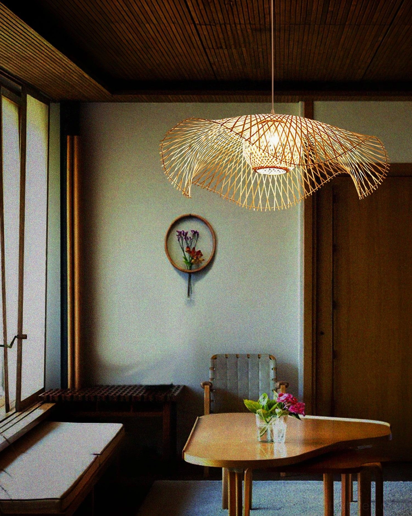 Natural bamboo lotus leaf hanging pendant with organic silhouette ideal for dining rooms, kitchens, and contemporary interiors