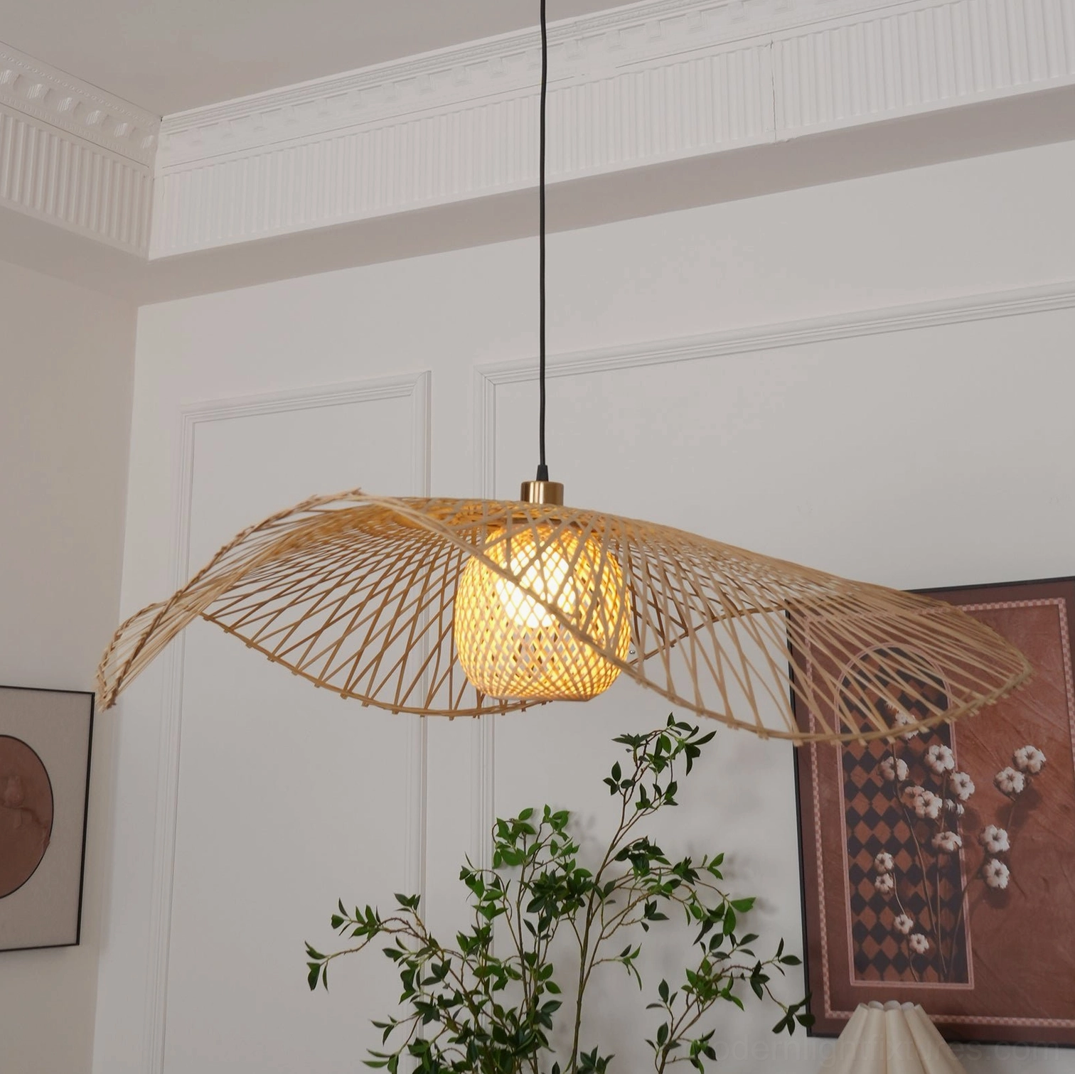 Handcrafted bamboo lotus leaf pendant light with brass ceiling mount and natural bamboo woven texture, glowing warm bulb illumination