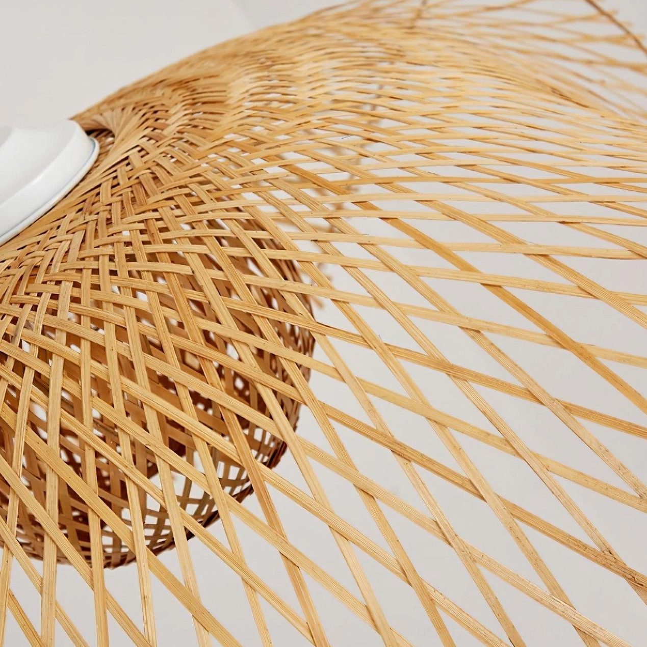 Bamboo lotus leaf pendant light installation in upscale dining environment with warm ambient lighting and shadow play