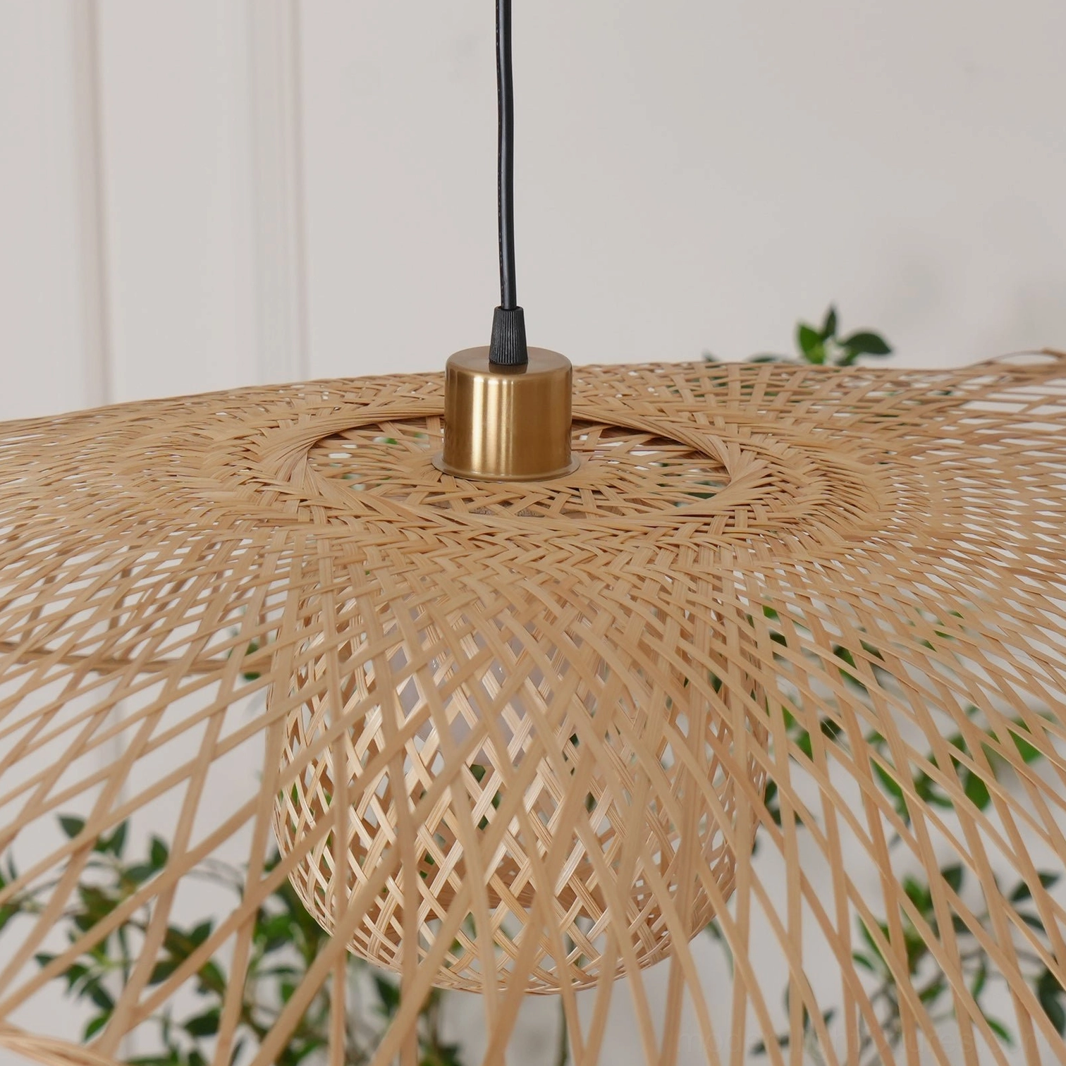 Close-up detail of bamboo lotus leaf pendant lamp showing intricate woven bamboo grid pattern, natural light wood color with exposed lamp interior
