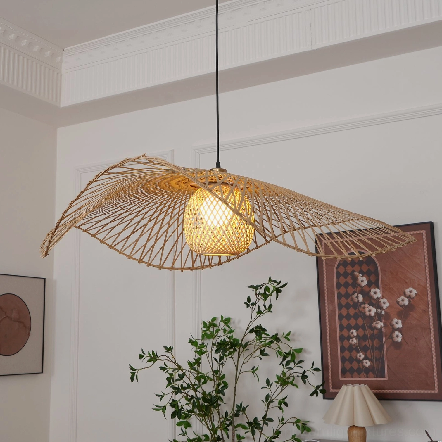 Bamboo lotus leaf pendant light with black hanging cord in modern minimalist living room, oblique front view with warm indoor lighting