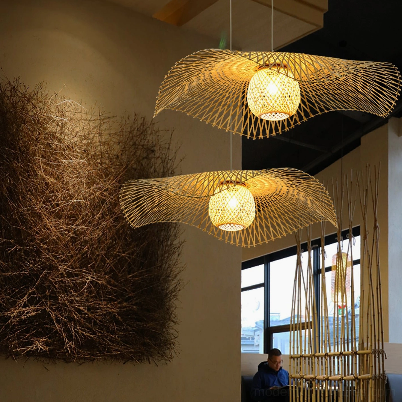 Woven bamboo ceiling light in Scandinavian minimalist interior with natural wood accents and contemporary design elements