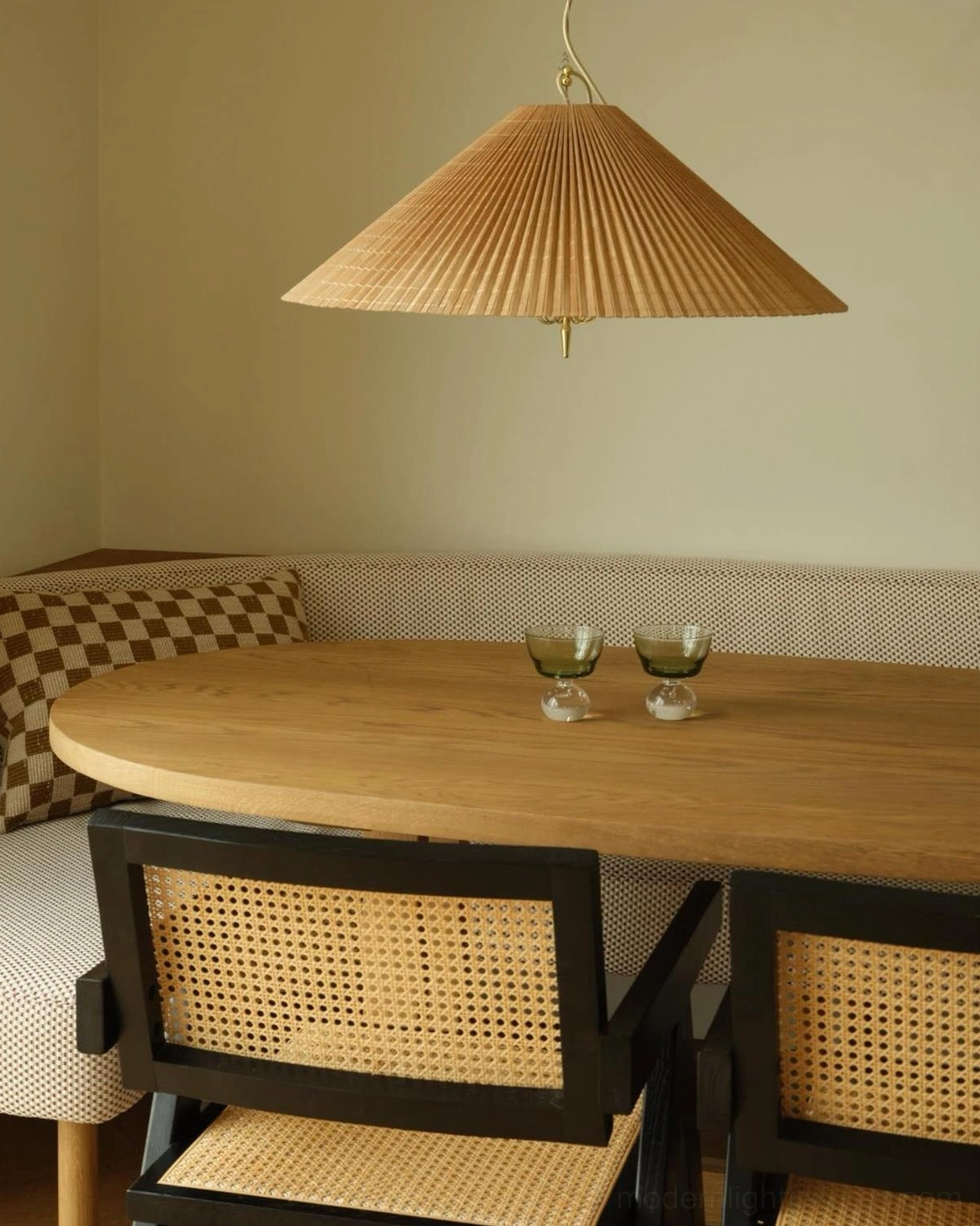 Bamboo conical pendant shade under-view showing light diffusion and dappled shadow pattern