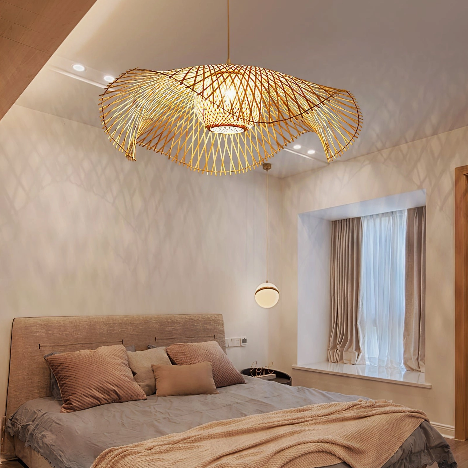 Handwoven bamboo pendant light installed overhead in bedroom, demonstrating warm ambient lighting in residential interior