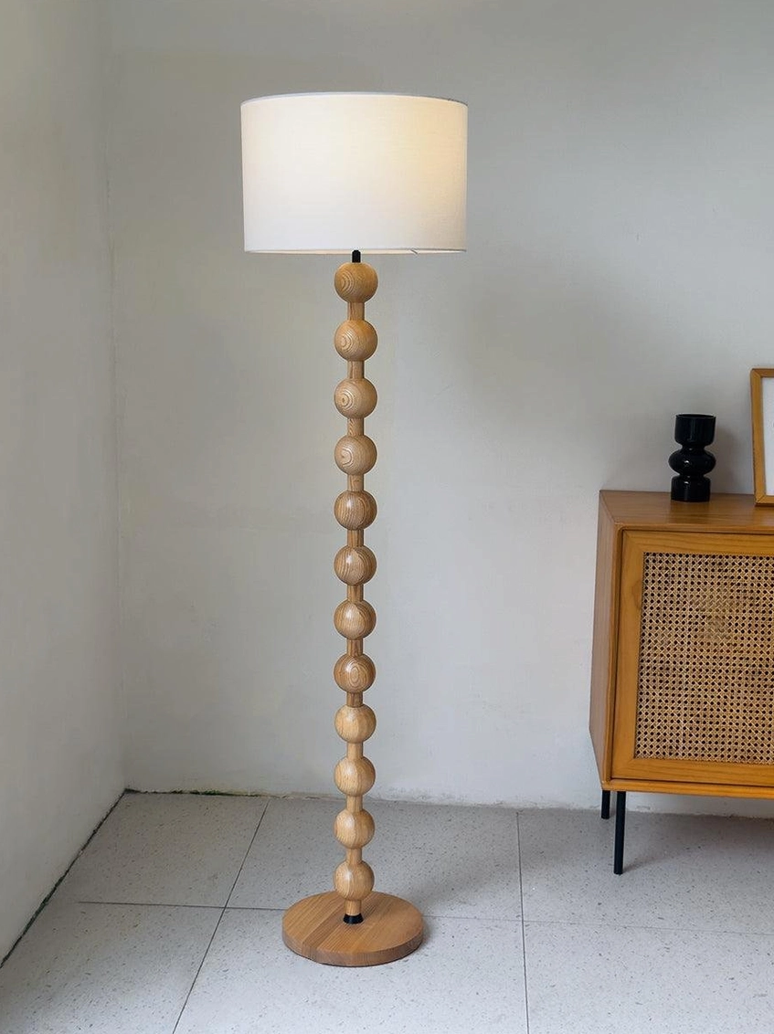 Barbell floor lamp with 160cm height creating vertical room emphasis